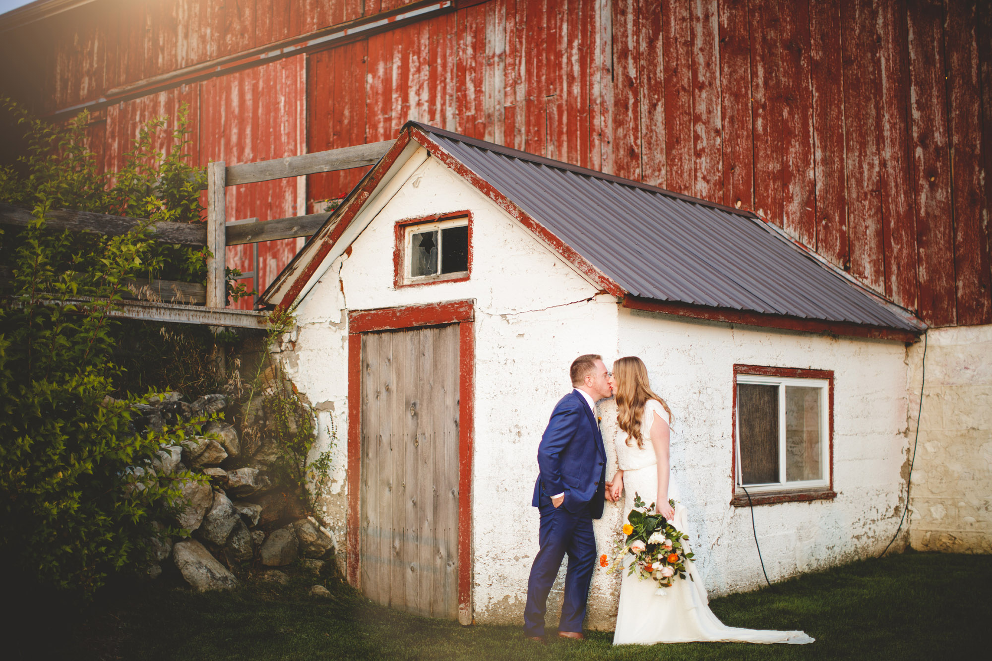 Bride Group kiss barn Cambium Farms wedding photography