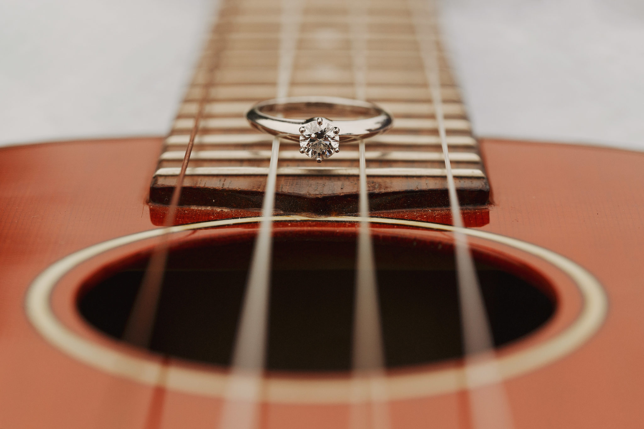 engagement ring on guitar