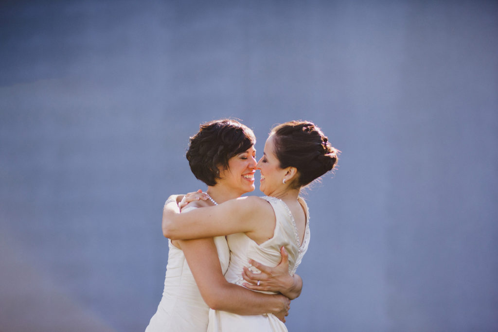 playful lesbian couple wedding brides southbrook winery niagara
