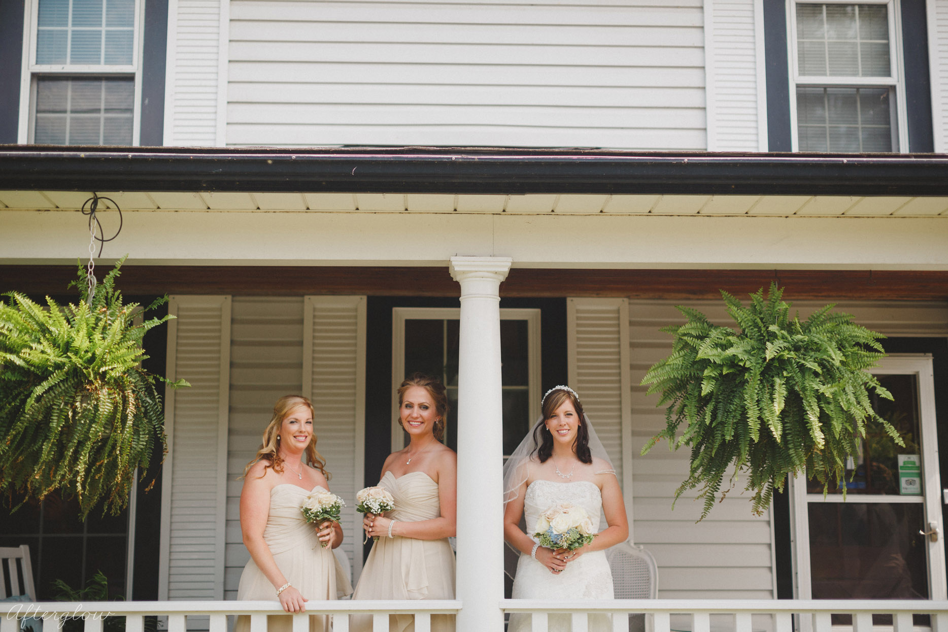 three pretty girls outside on porch