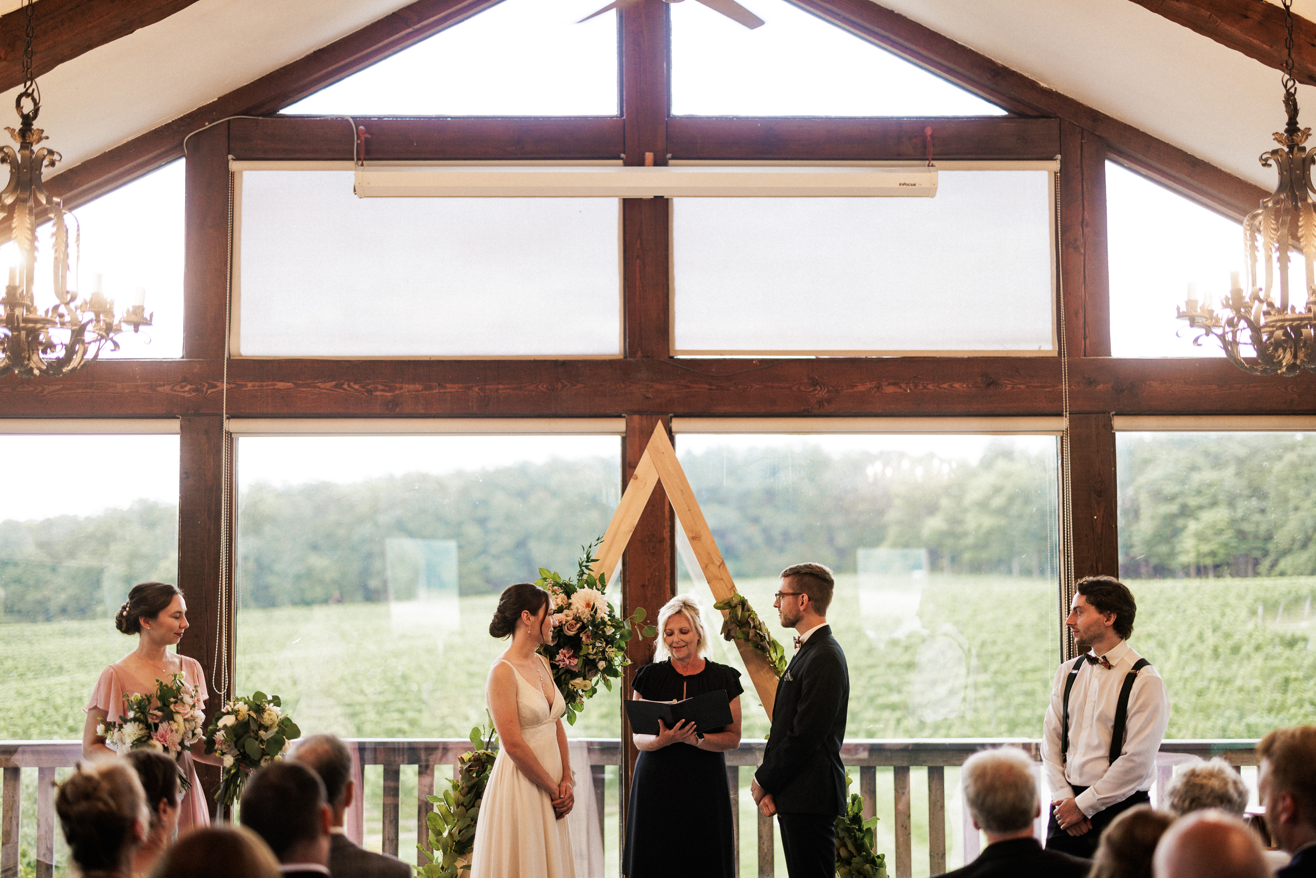 wedding ceremony inside carriage house vineland estates winery a