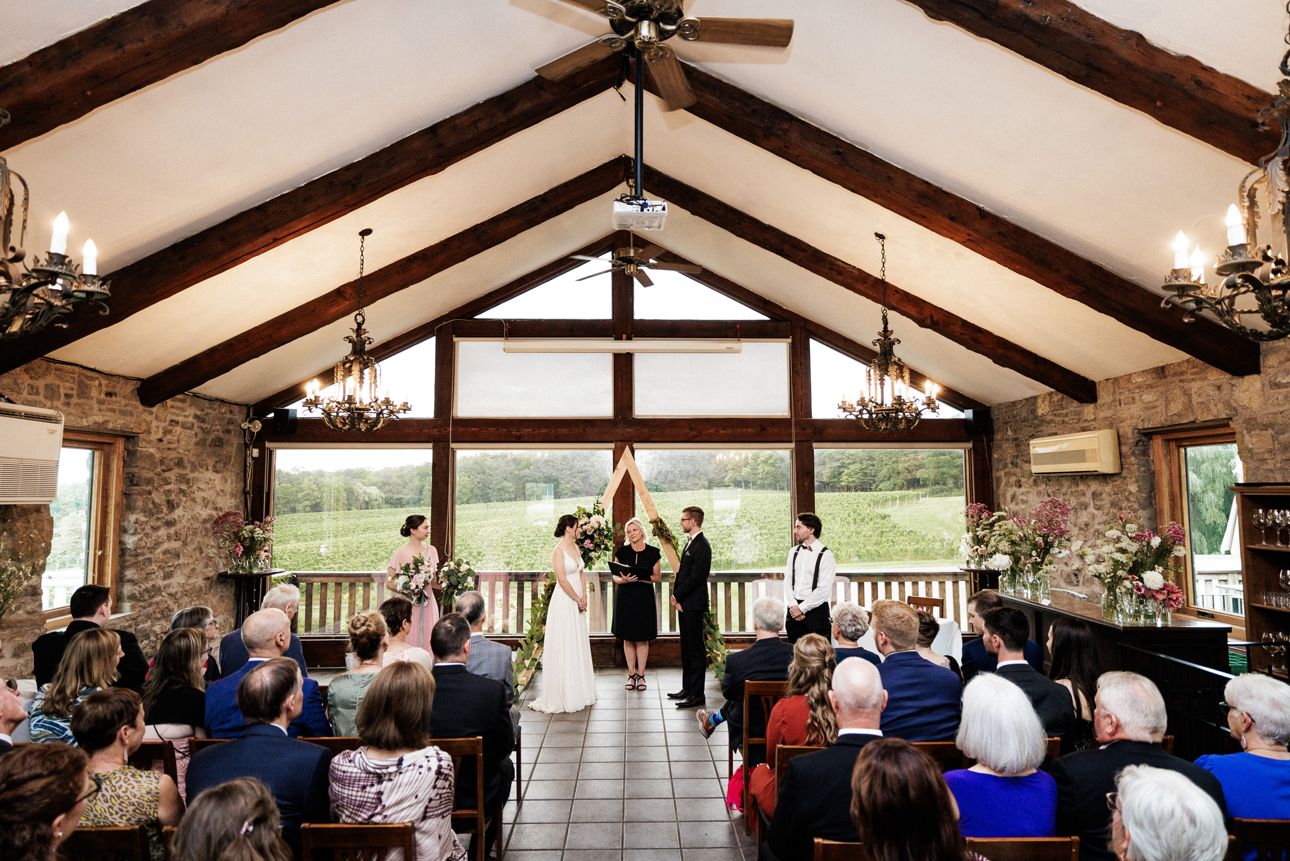 wedding ceremony inside carriage house vineland estates winery a