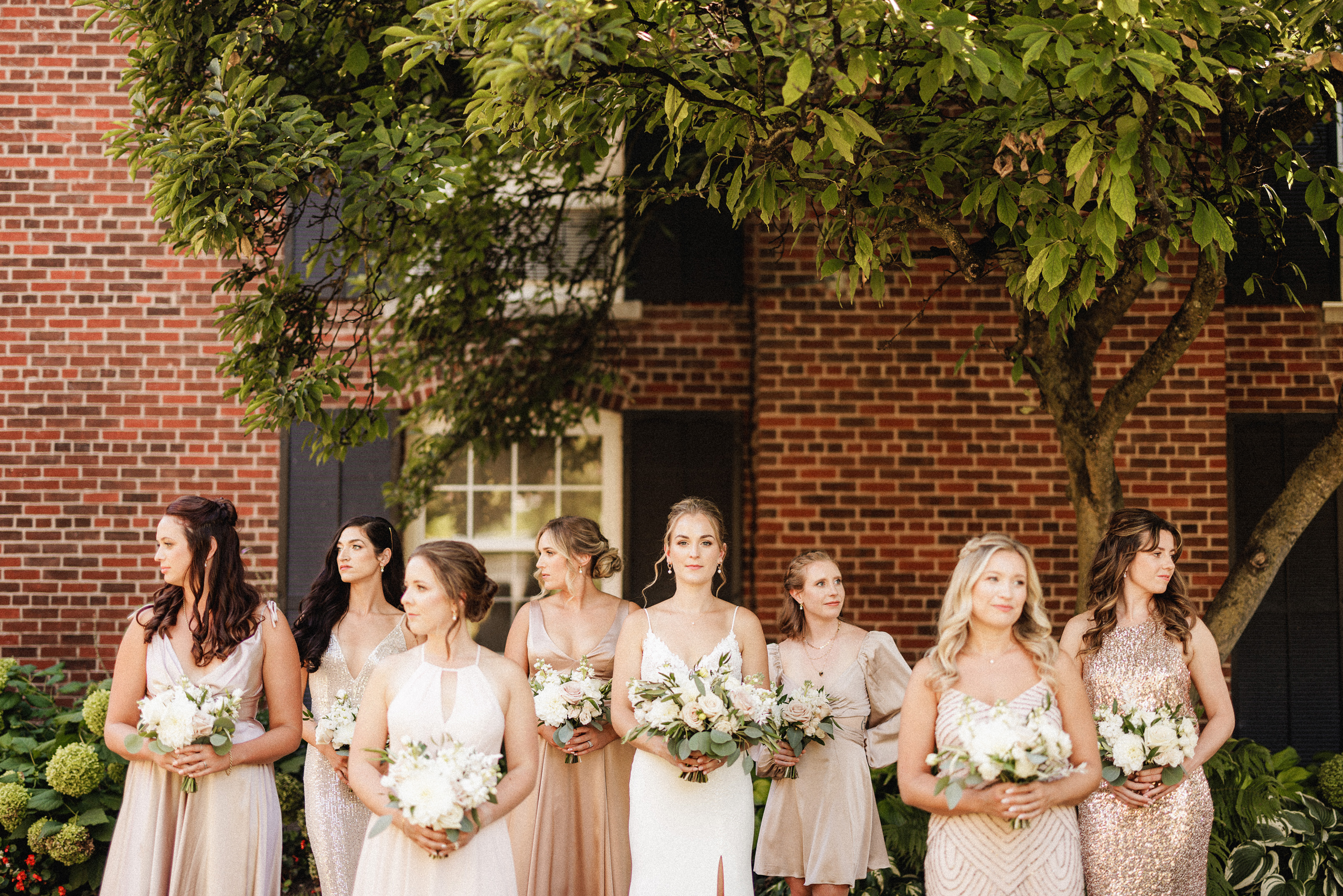 bridal party wedding in courtyard pillar and post niagara on the