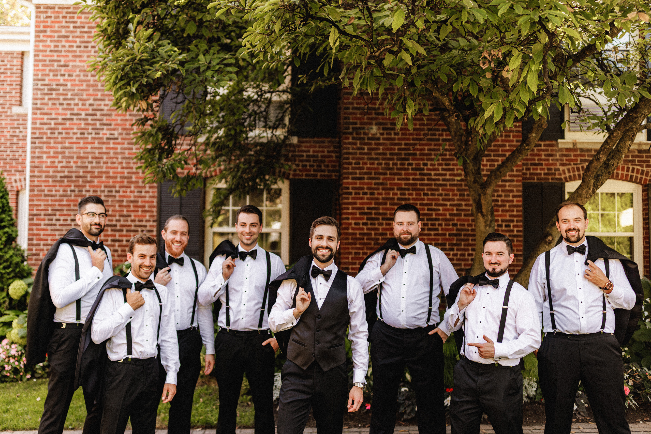 bridal party wedding in courtyard pillar and post niagara on the