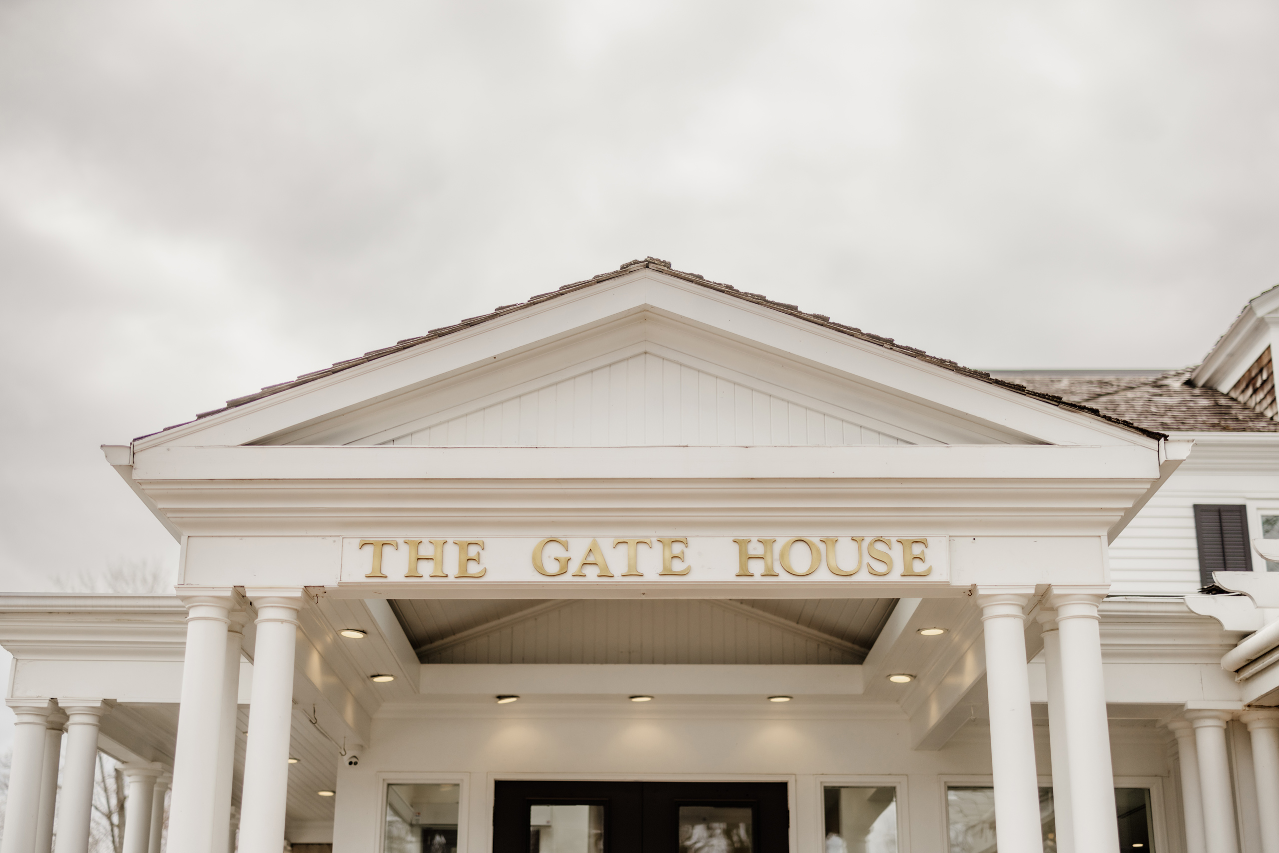 spring wedding gate house lush florals ceremony arbor