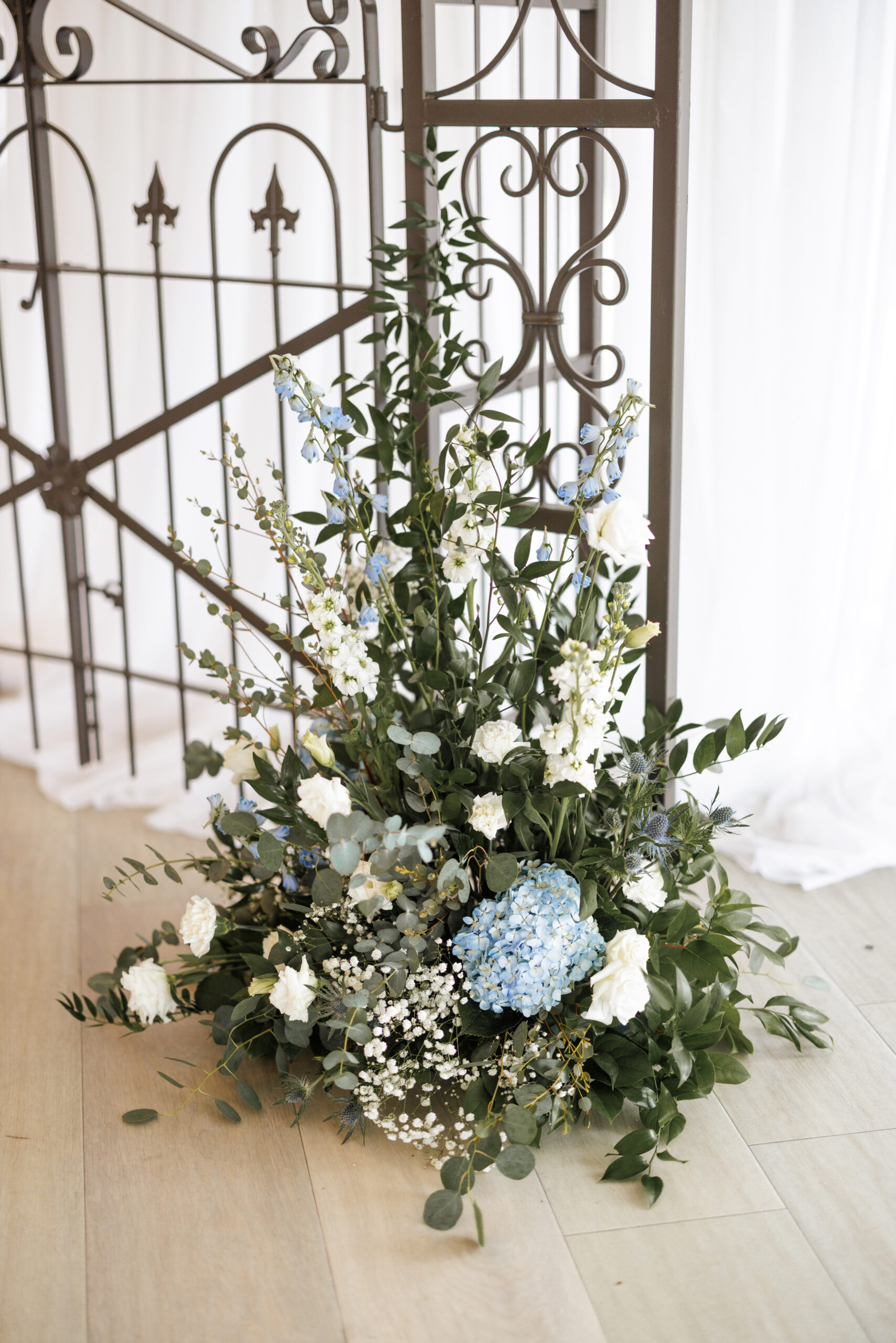 spring wedding gate house lush florals ceremony arbor