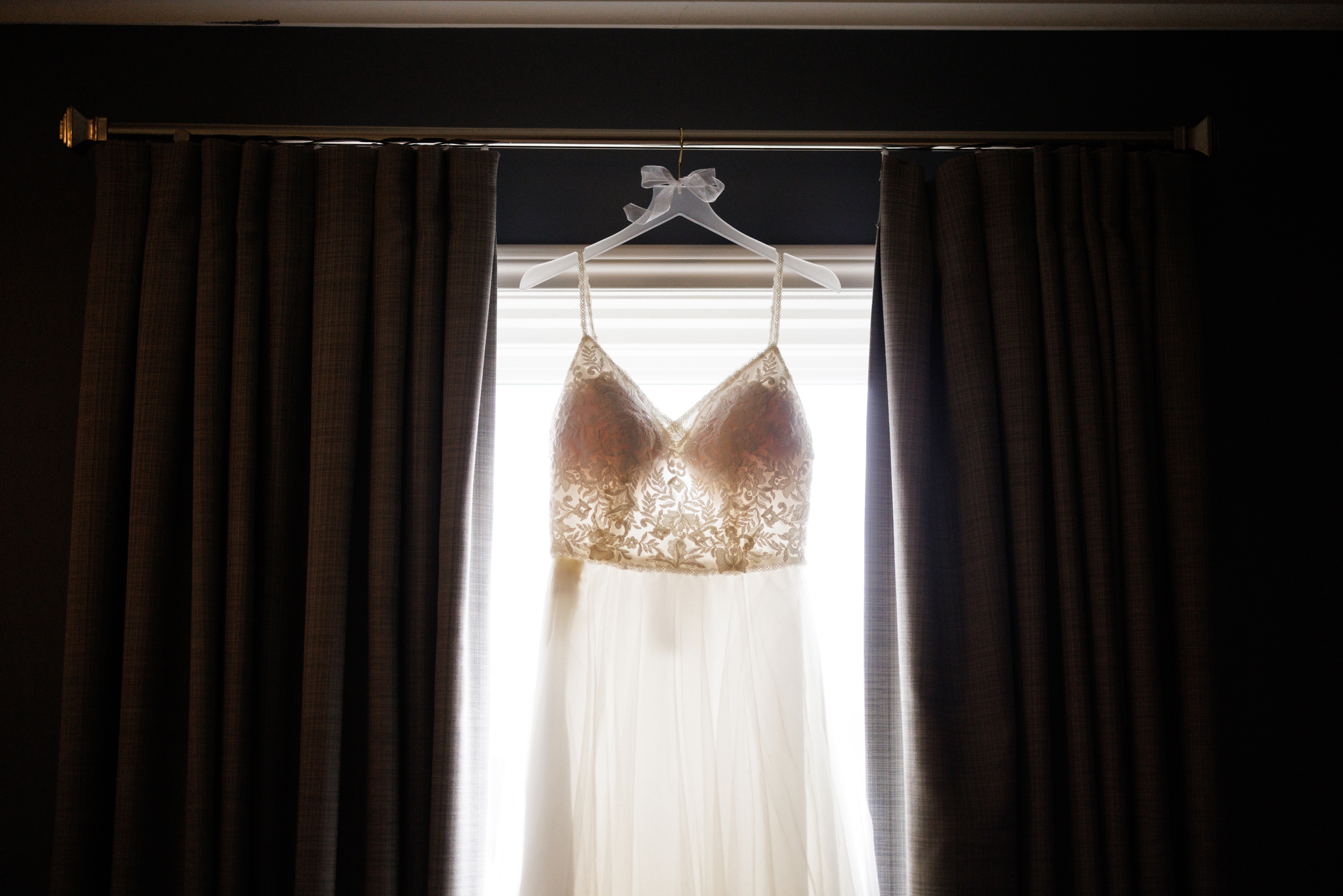 wedding dress hanging in window gate house niagara on the lake