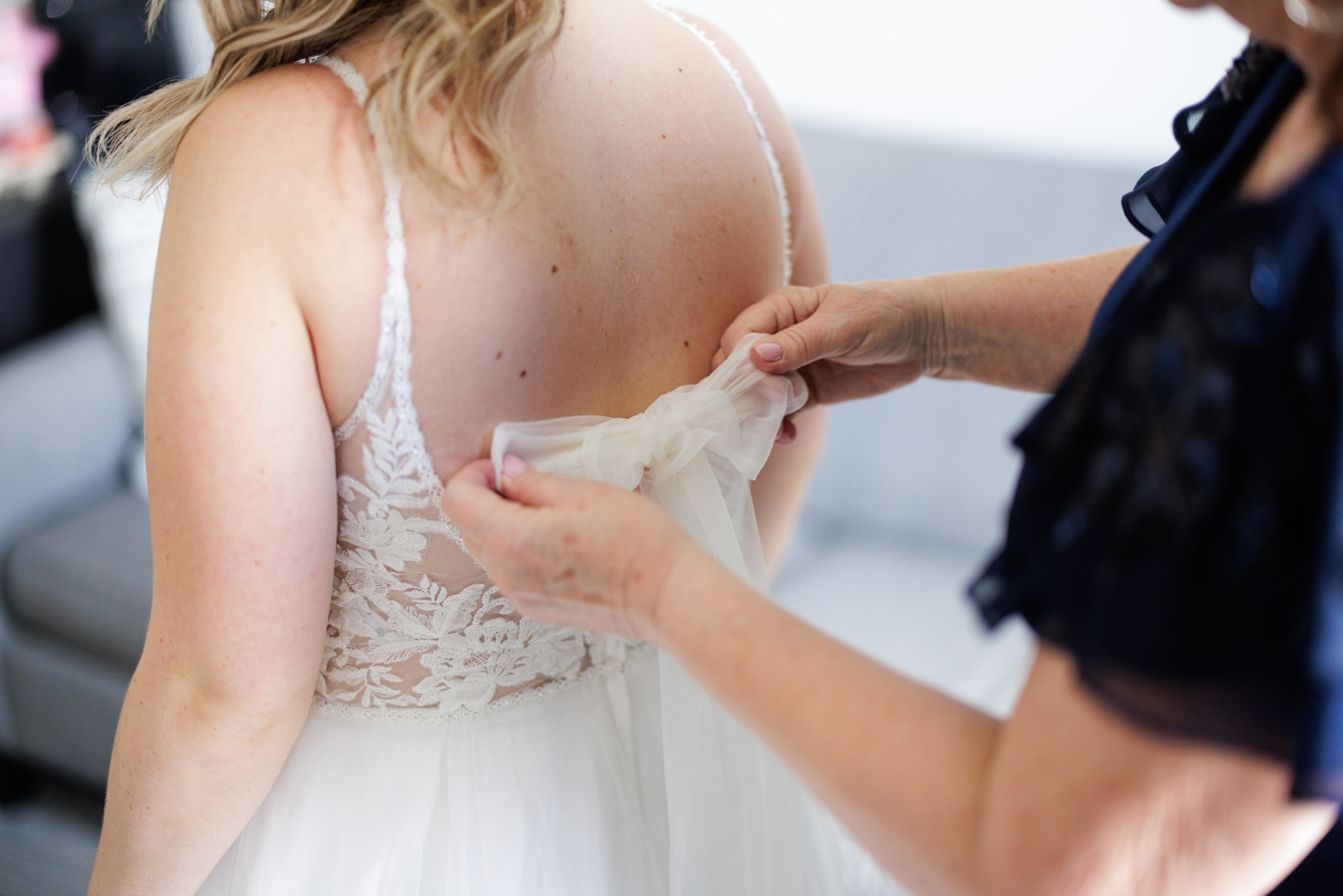 mother helping bride into dress niagara on the lake wedding