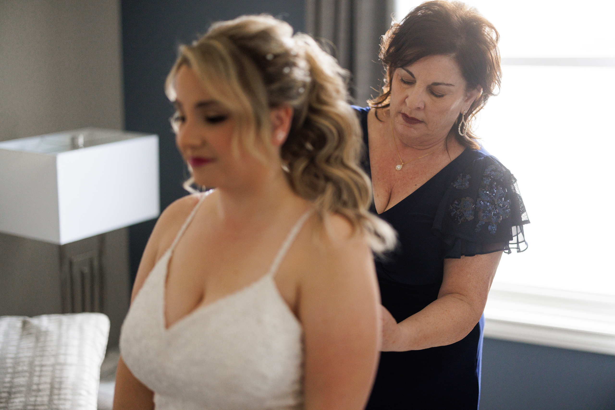 mother helping bride into dress niagara on the lake wedding