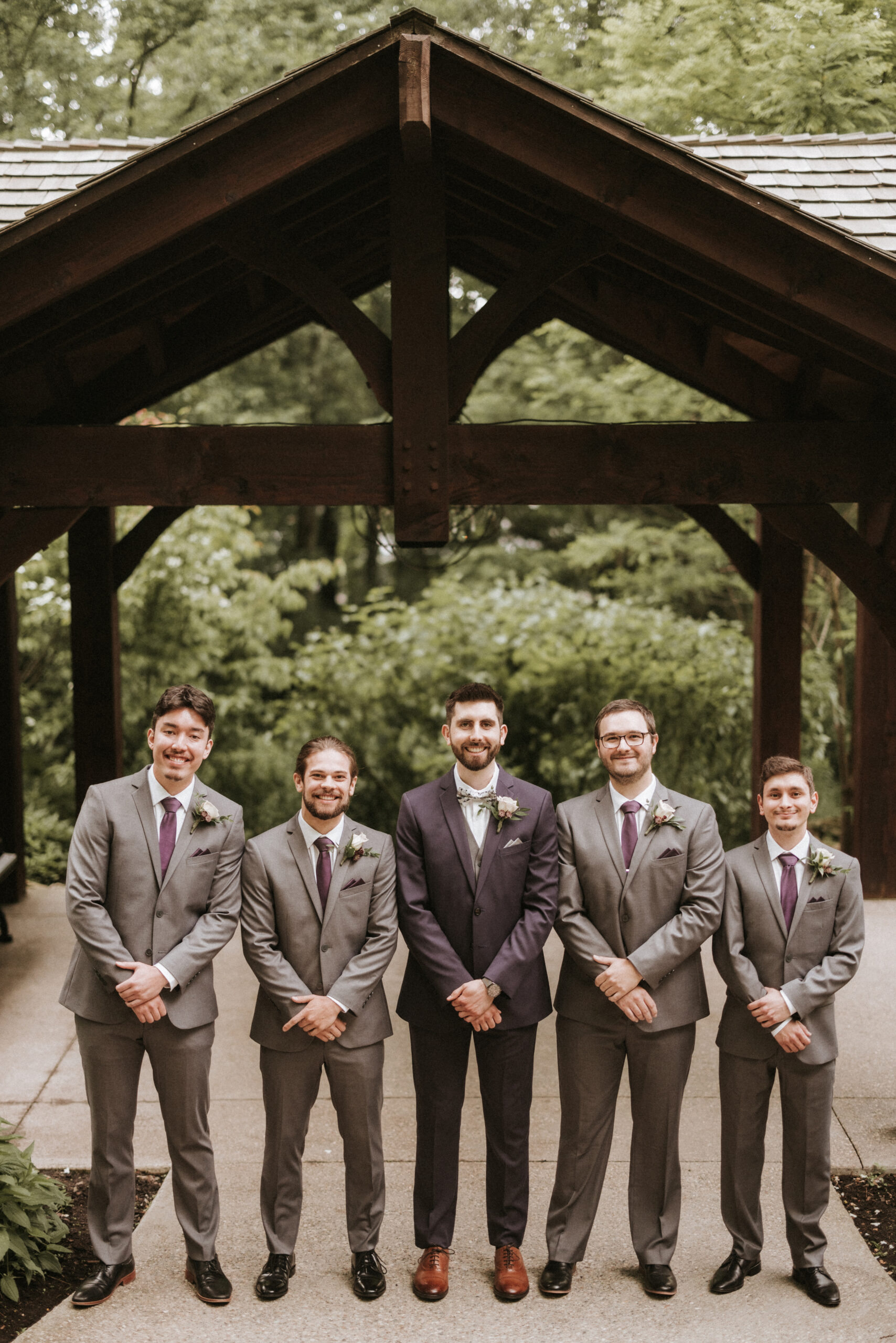 groomsmen walking bridge ancaster mill summer wedding