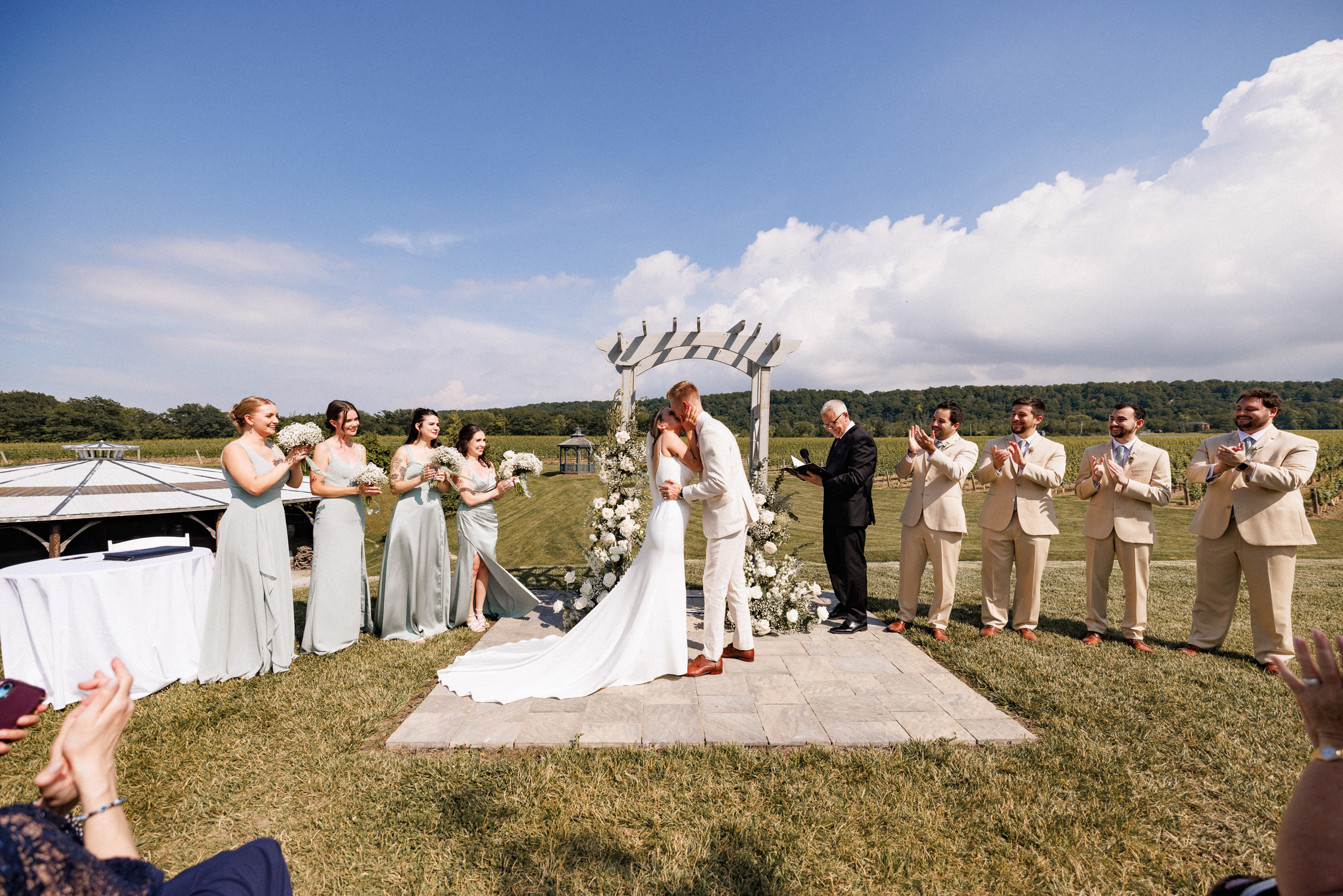 first kiss husband wife cave spring vineyard outdoor ceremony