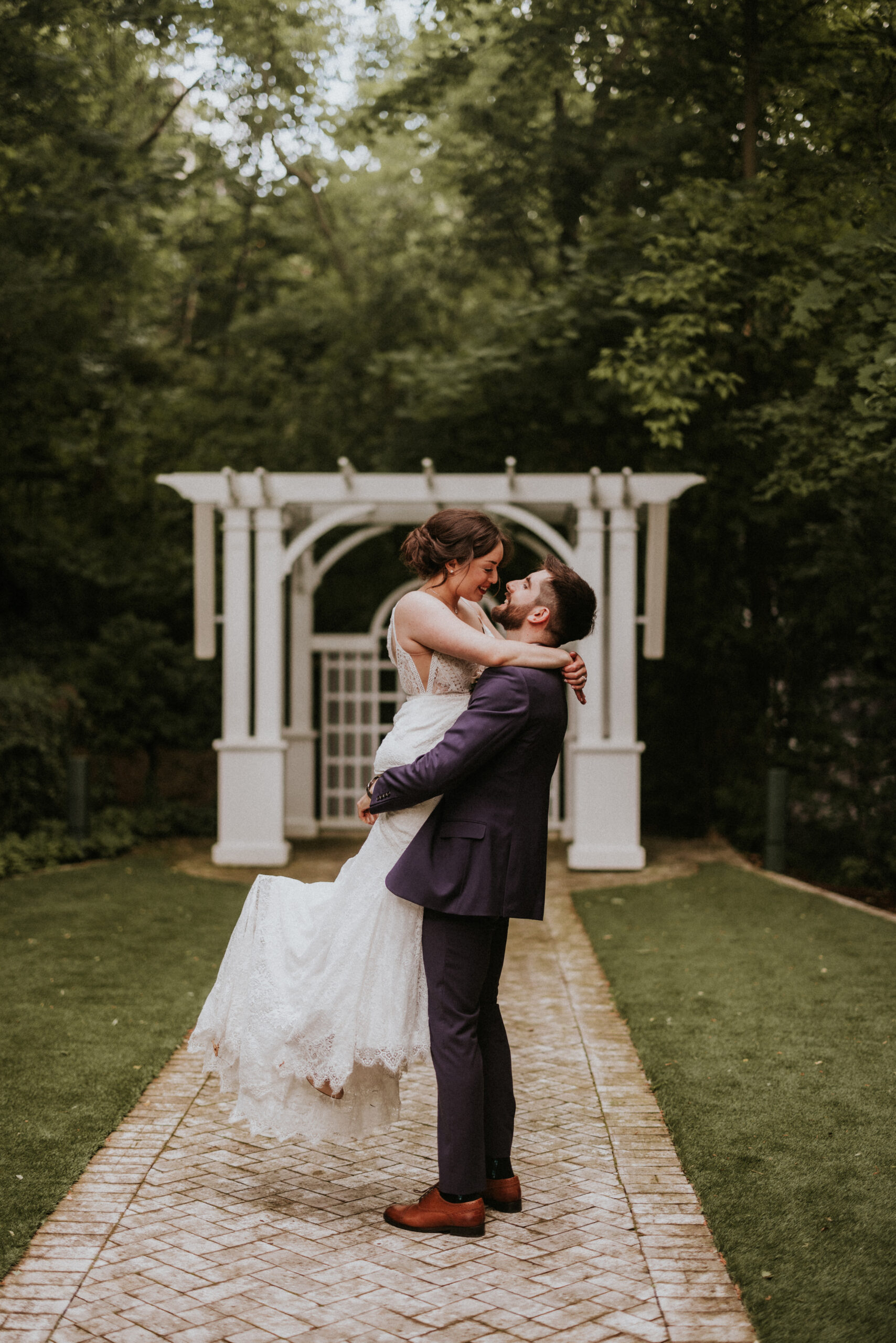 groom lifts bride romantic wedding photography ancaster