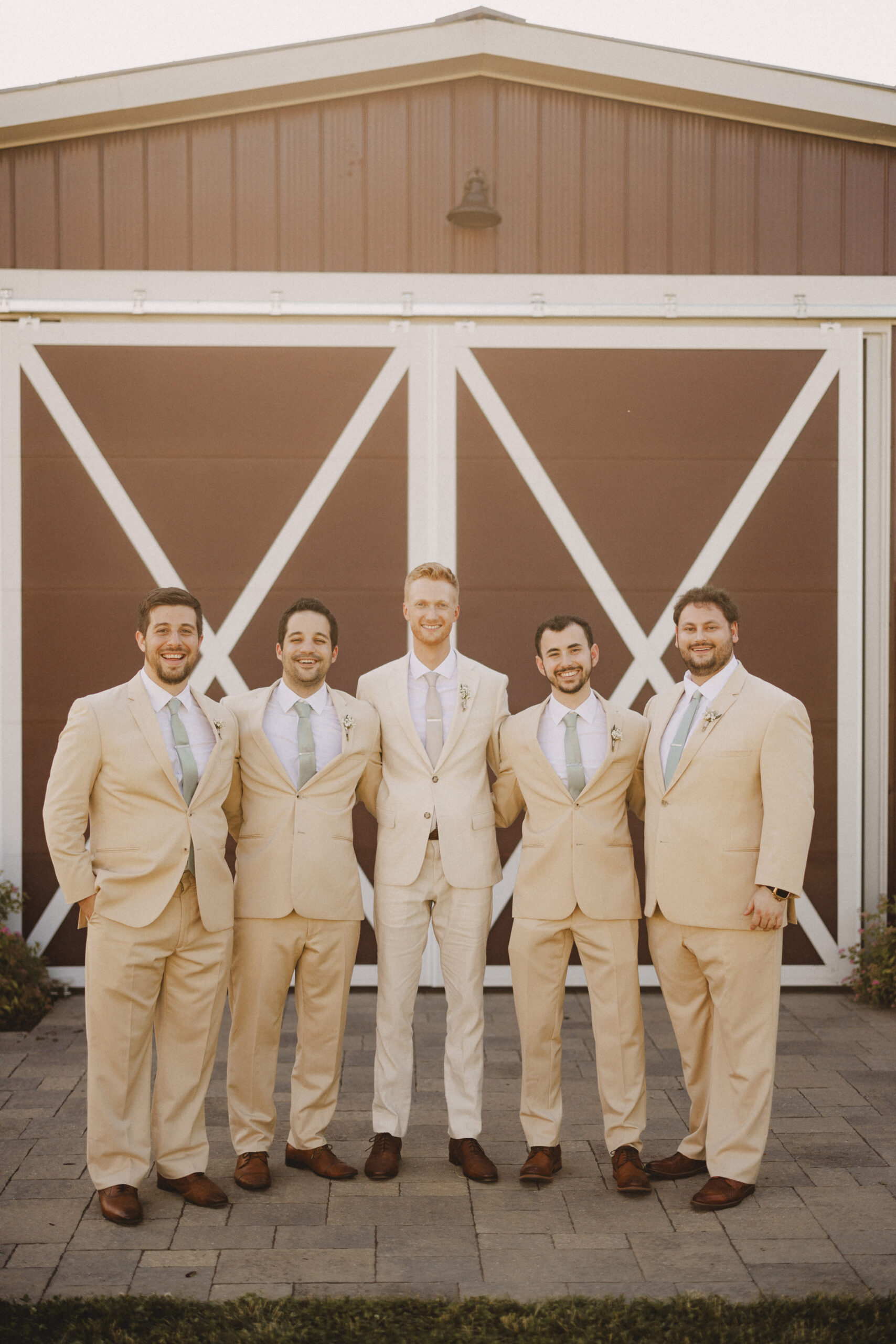 groom and groomsmen summer wedding cave spring vineyard afterglo