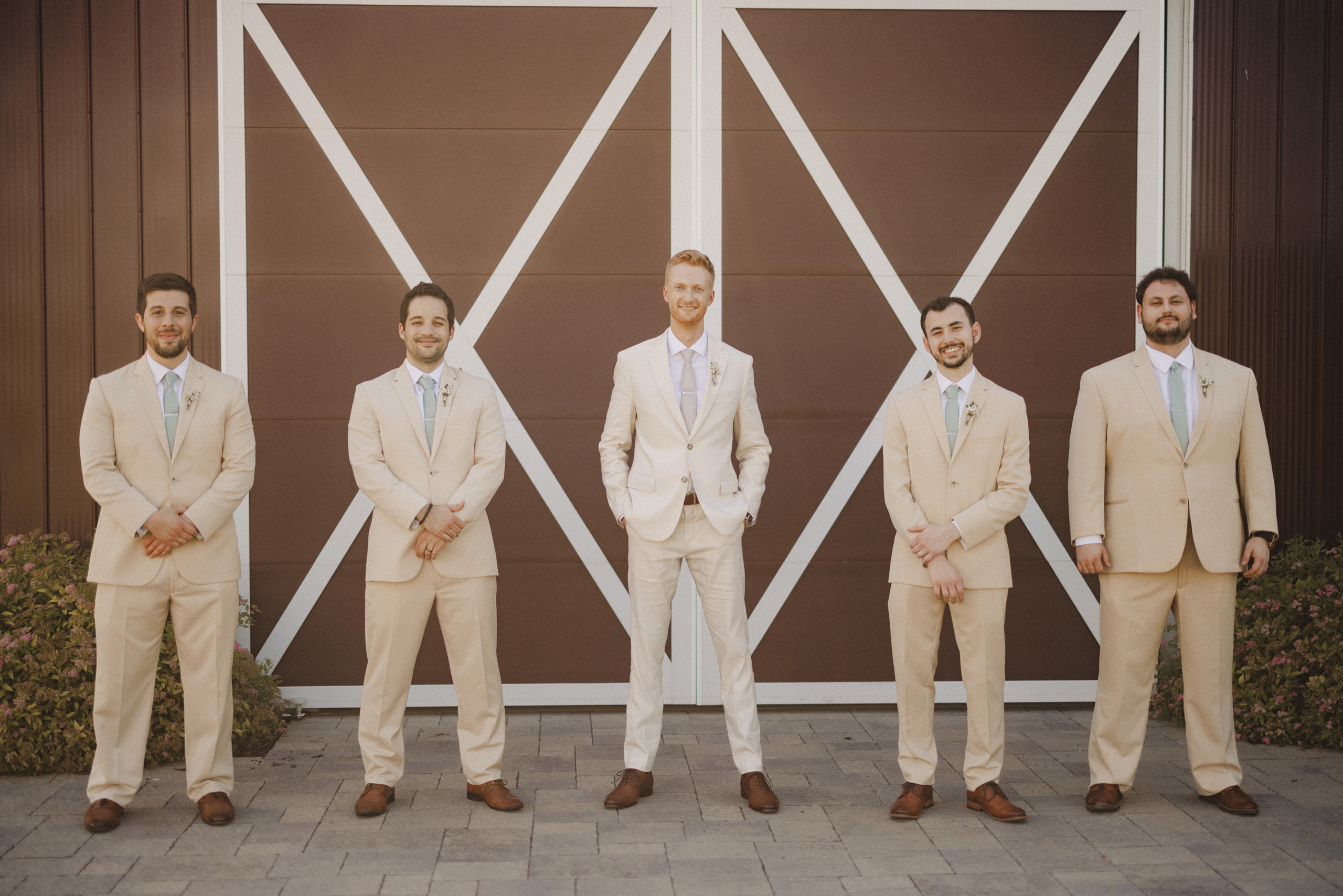 groom and groomsmen summer wedding cave spring vineyard afterglo