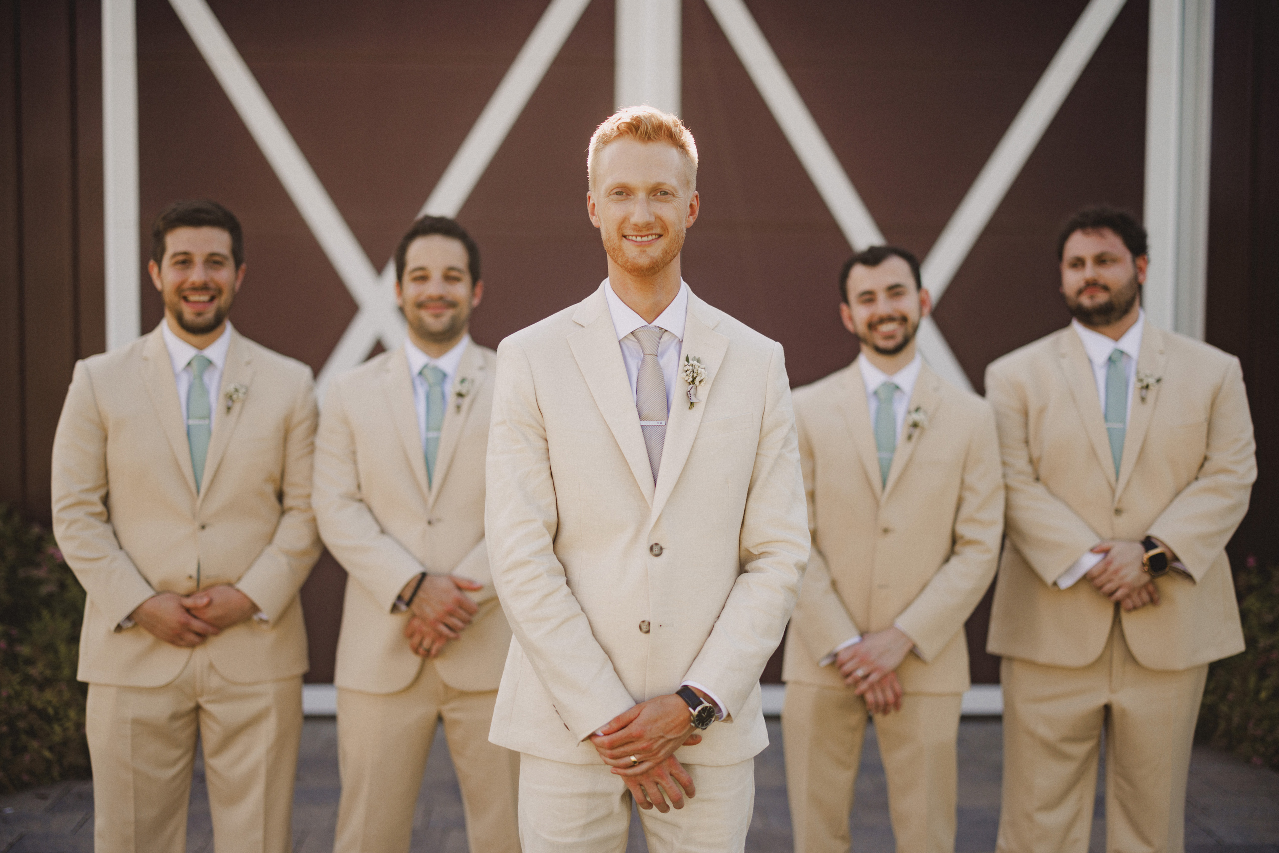 groom and groomsmen summer wedding cave spring vineyard afterglo