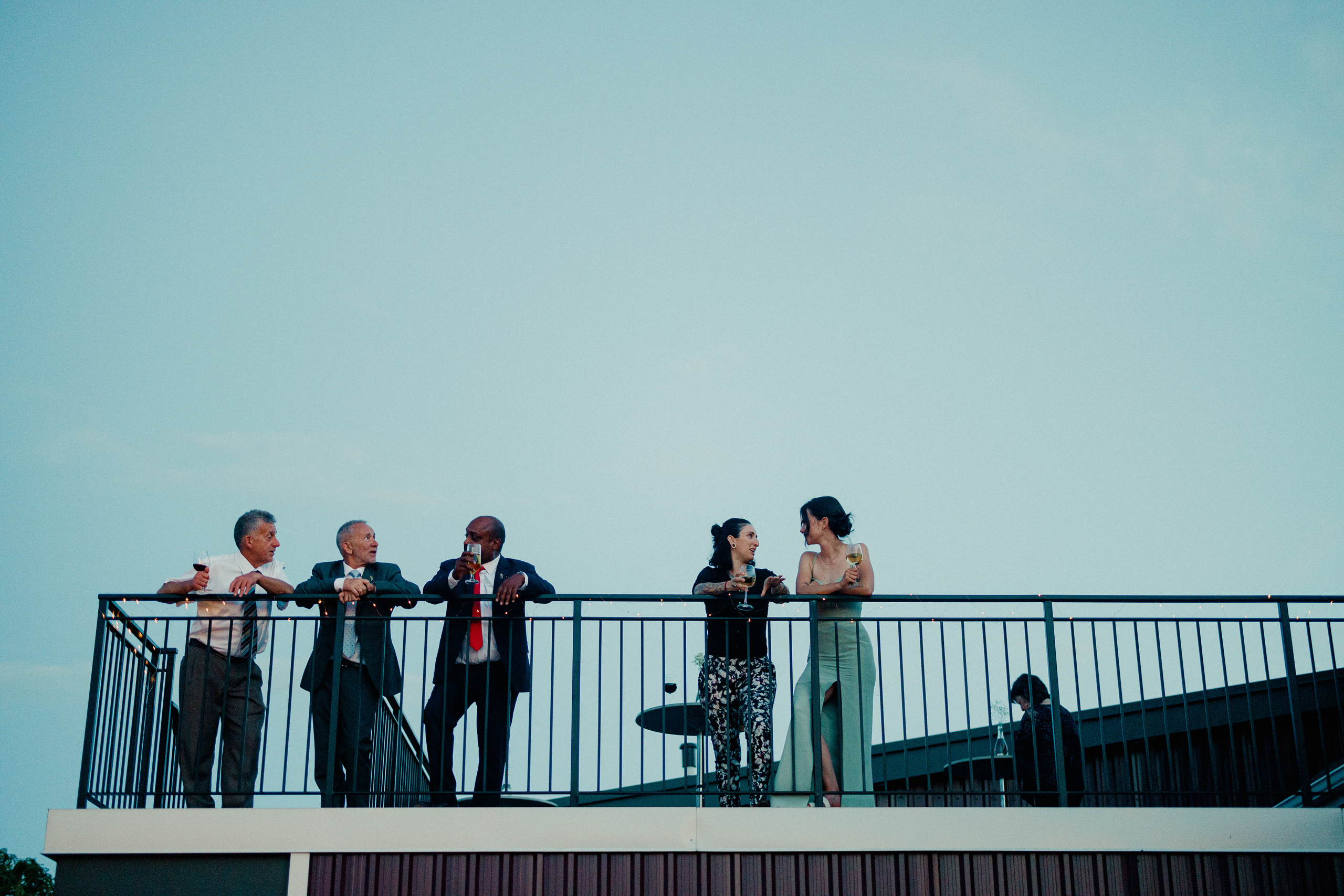 guests on rooftop terrace cave spring vineyard wedding