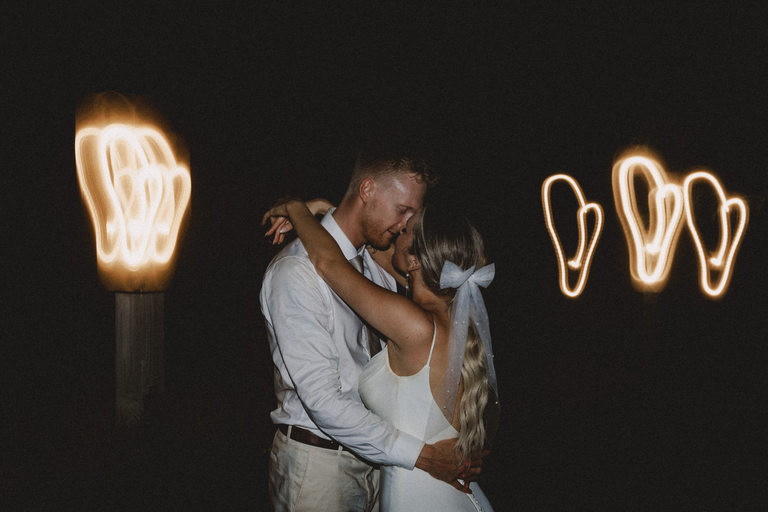 bride groom portrait in dark swirling lights wedding