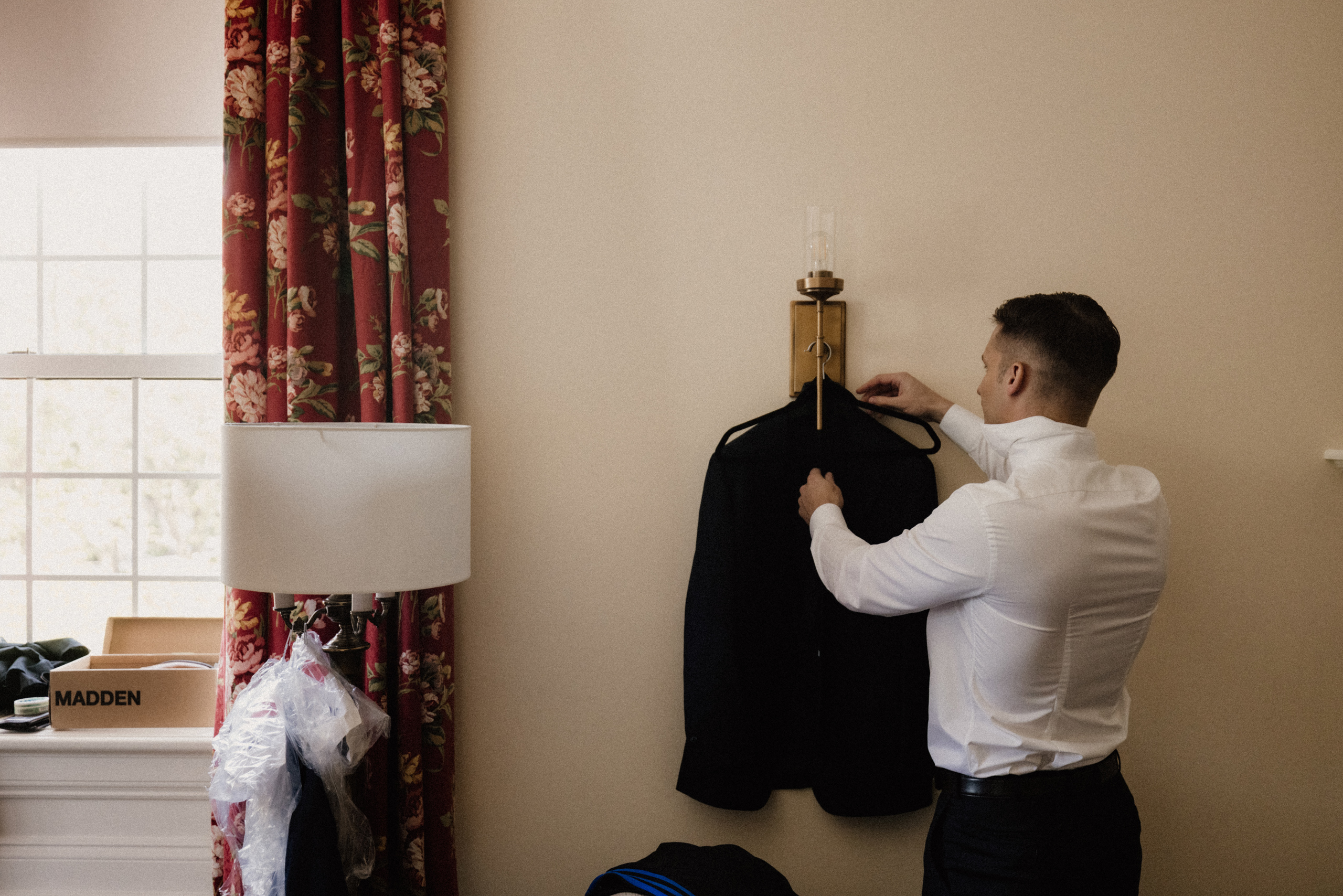 groom getting ready inn on the twenty