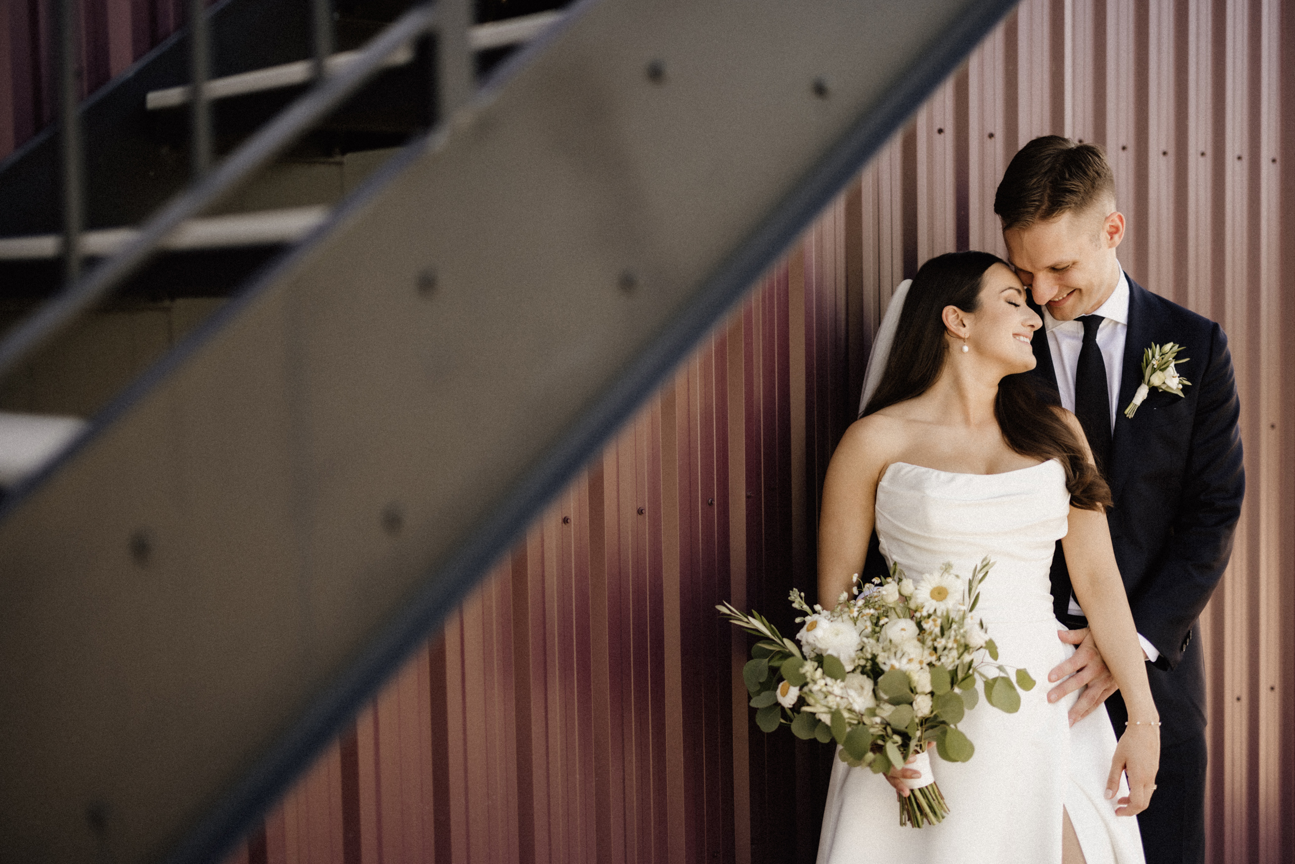 bride groom romantic under stairs cave spring barn