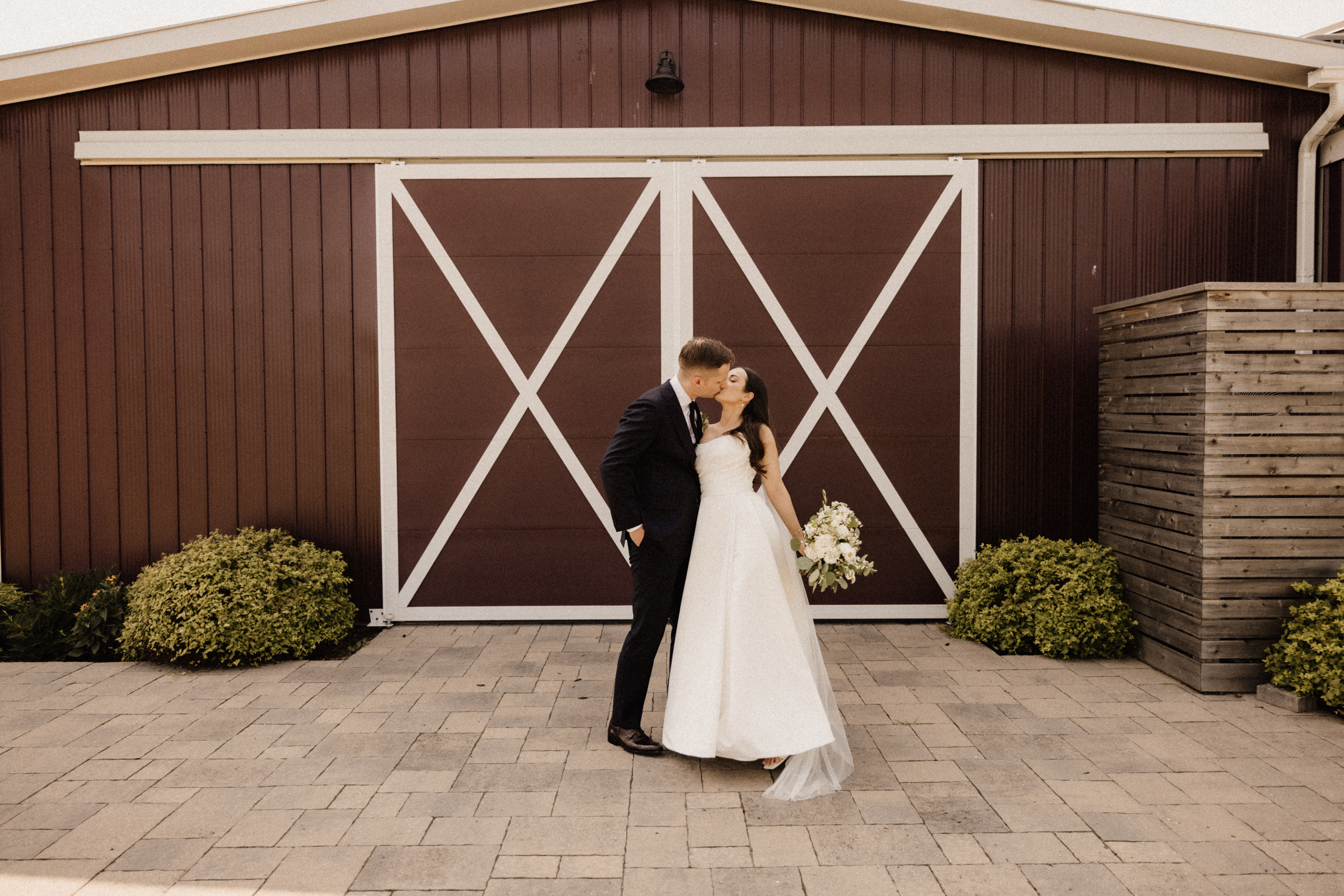 bride groom playful kiss barns at cave spring vineyard wedding s