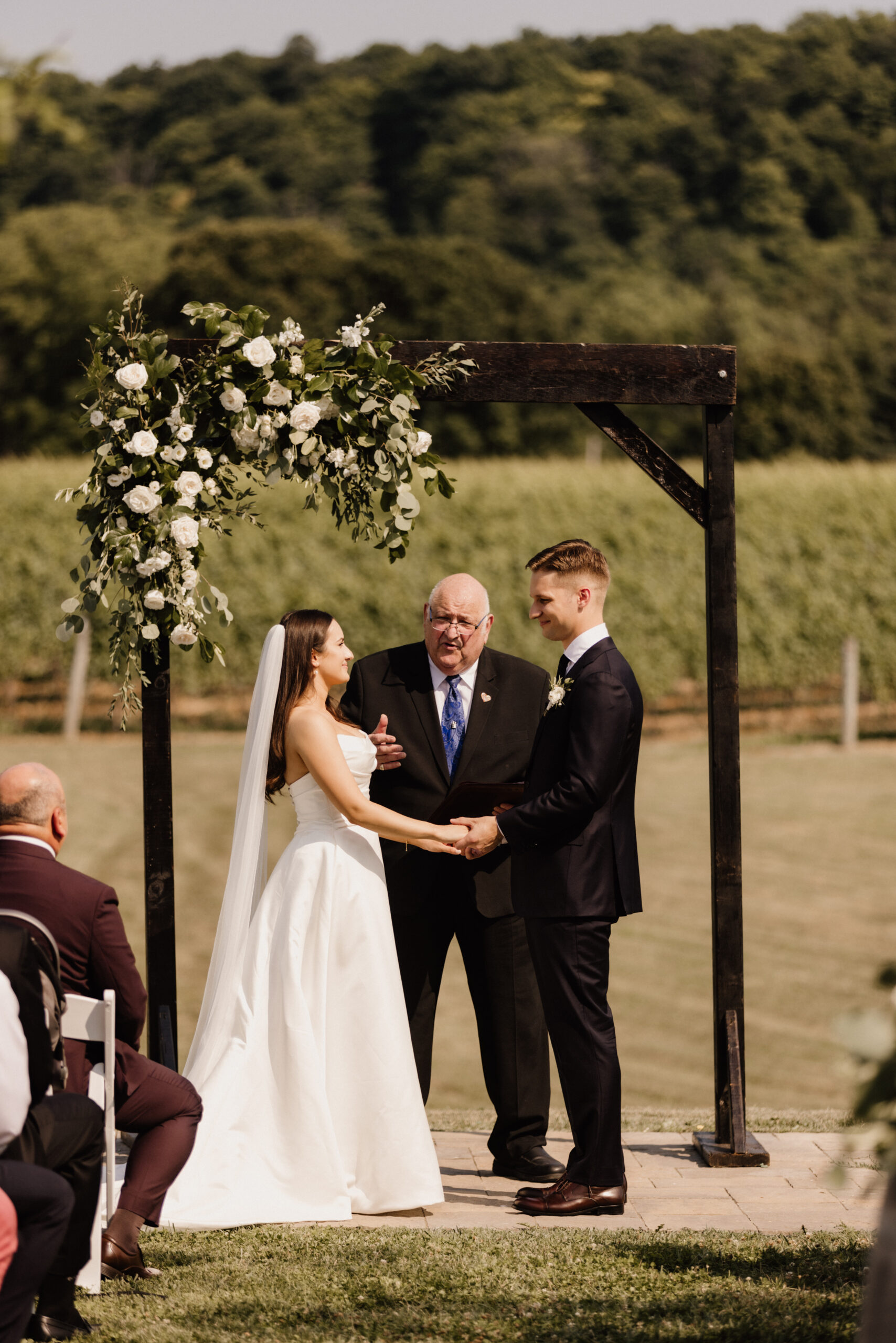 outdoor ceremony site barns at cave spring vineyard summer after