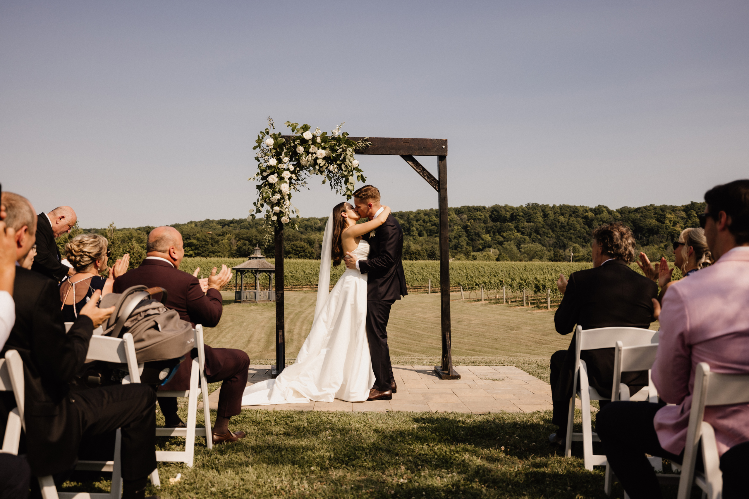 outdoor ceremony site barns at cave spring vineyard summer first
