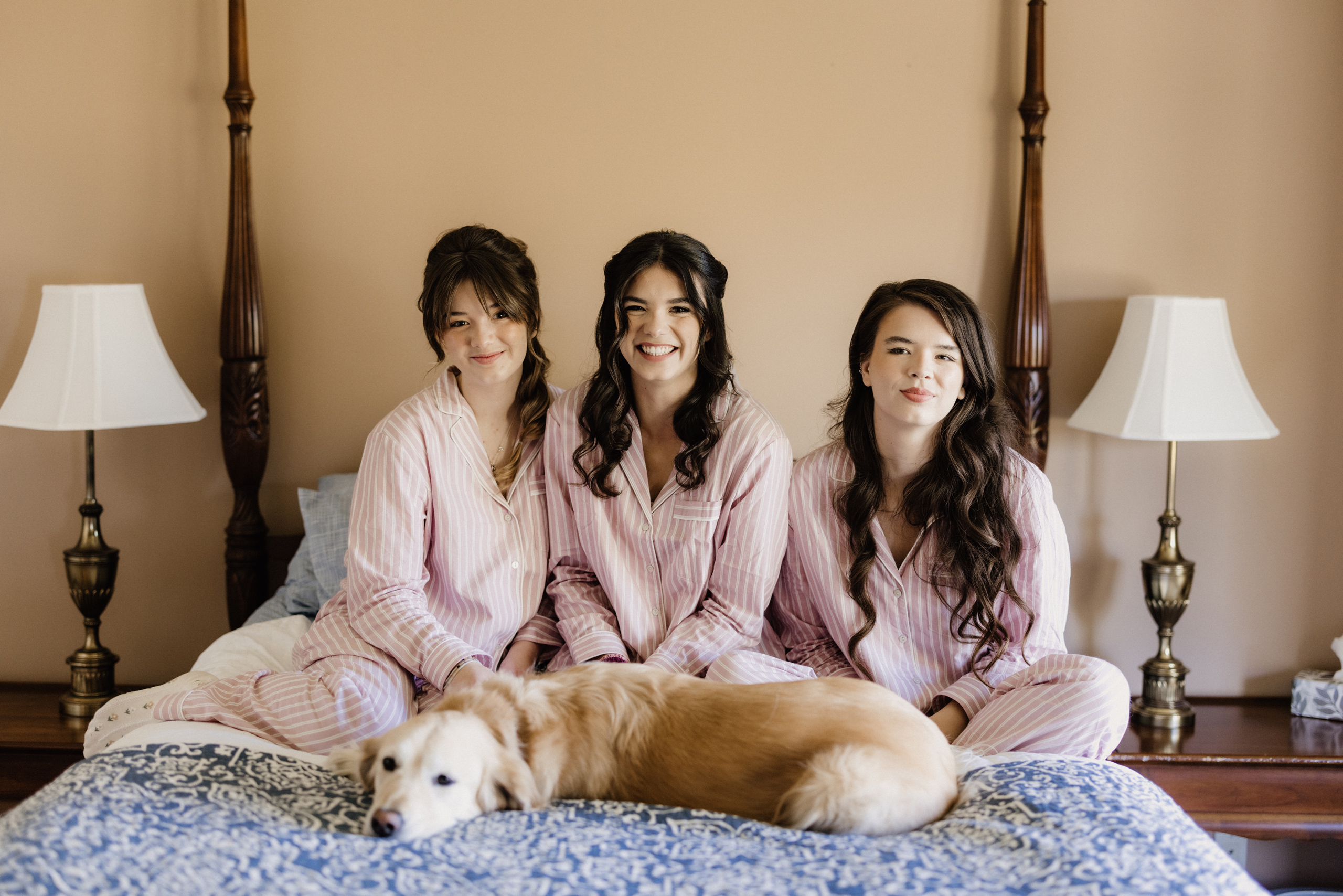 bridesmaids on bed getting ready cave spring estate house
