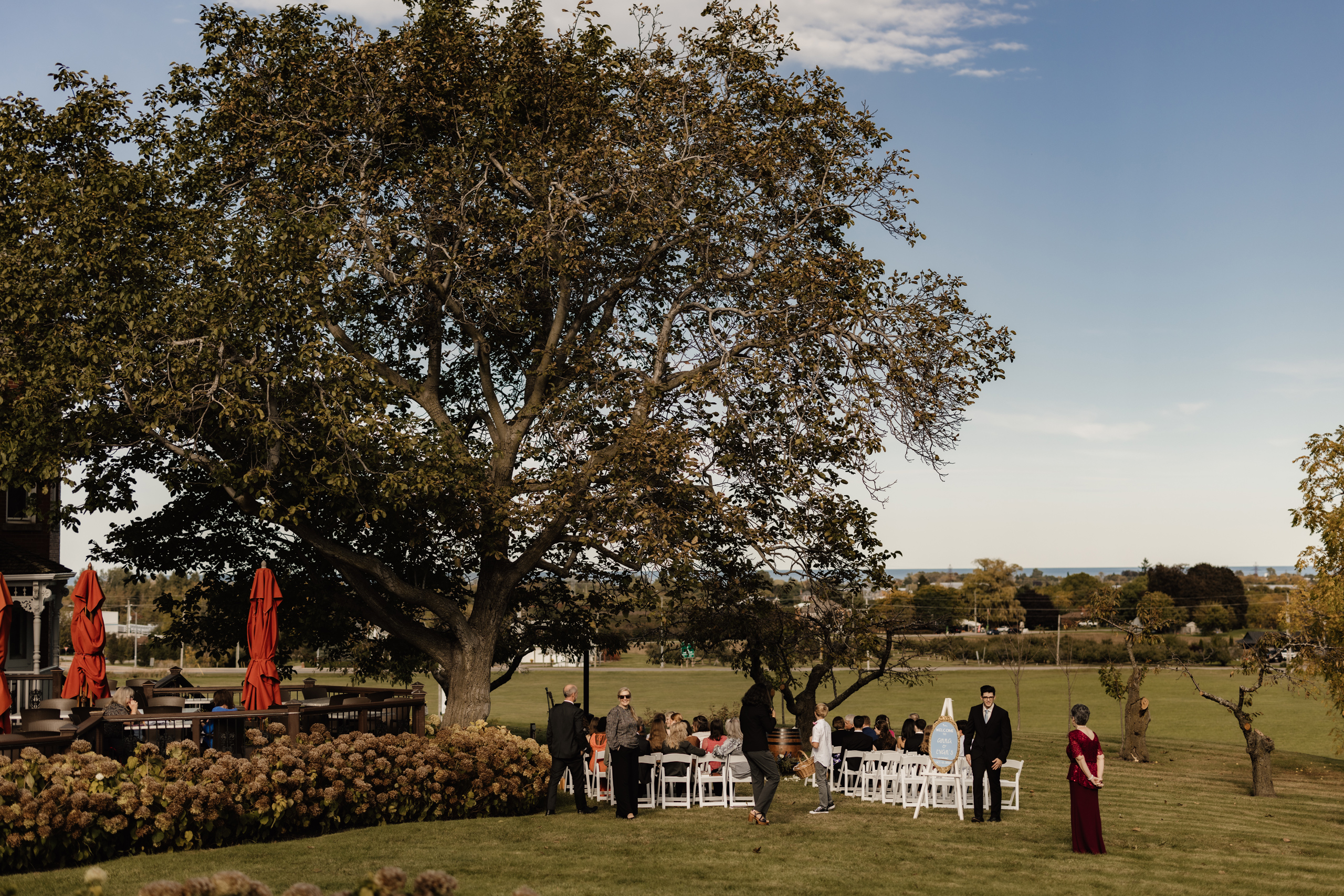 outdoor wedding ceremony under big tree peninsula ridge estates