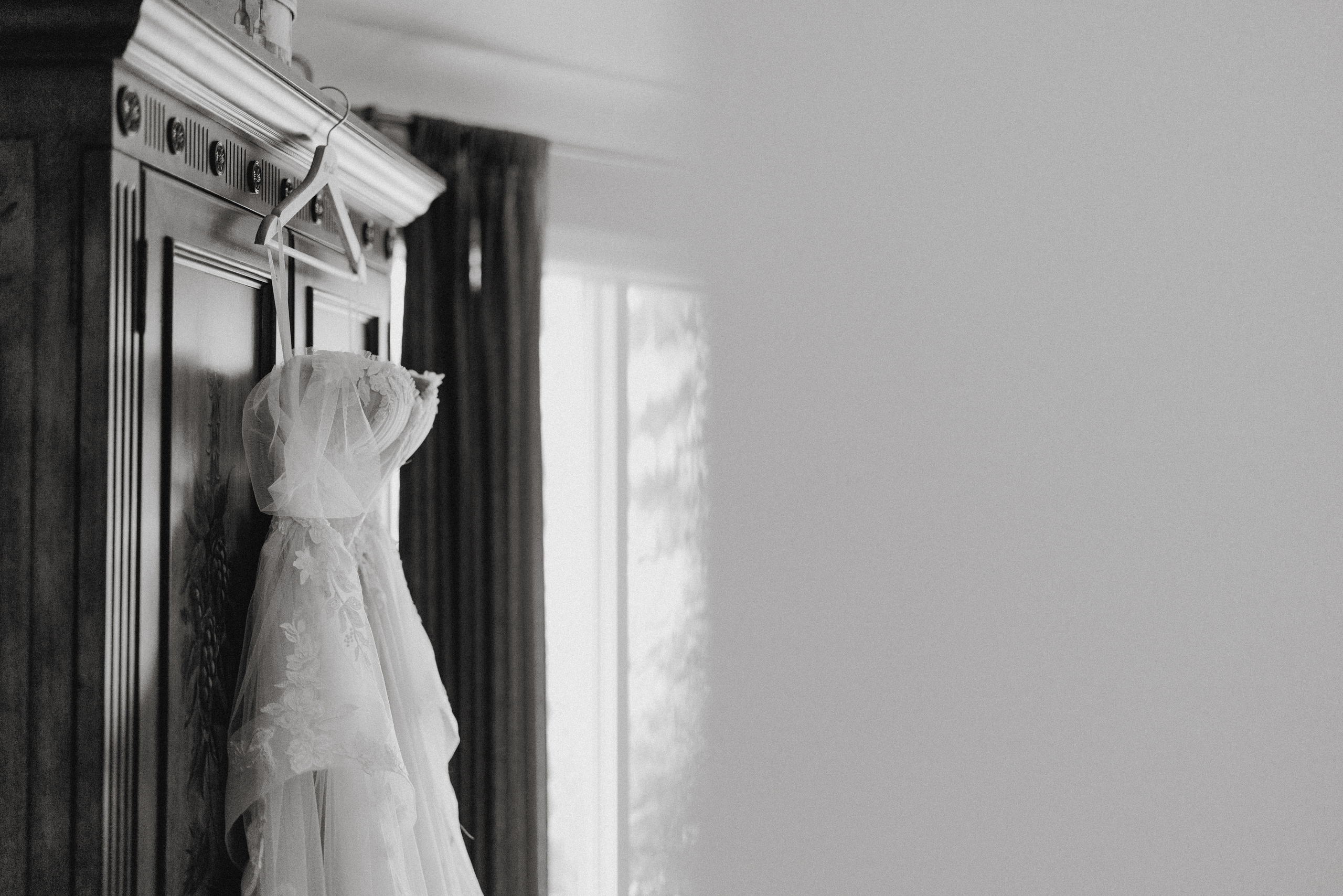 black white film wedding dress hanging