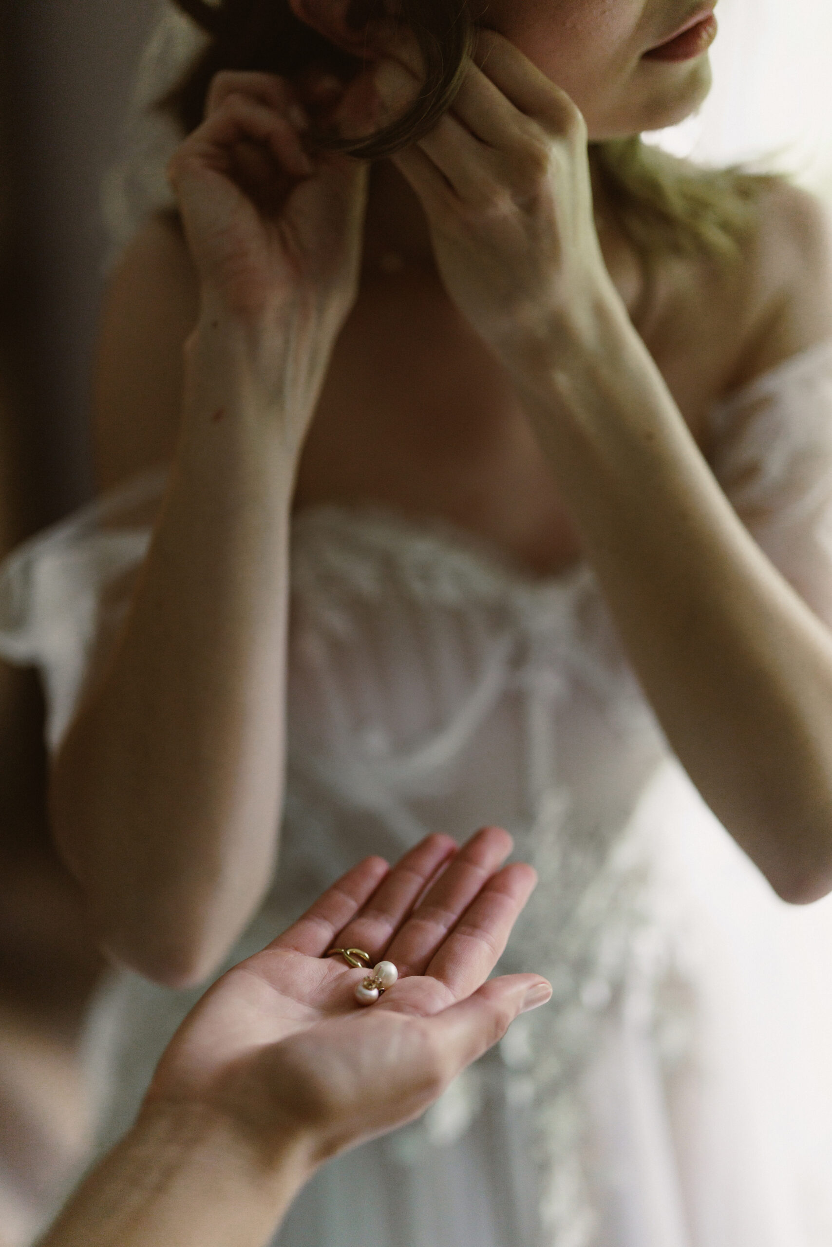 bride earrings getting ready