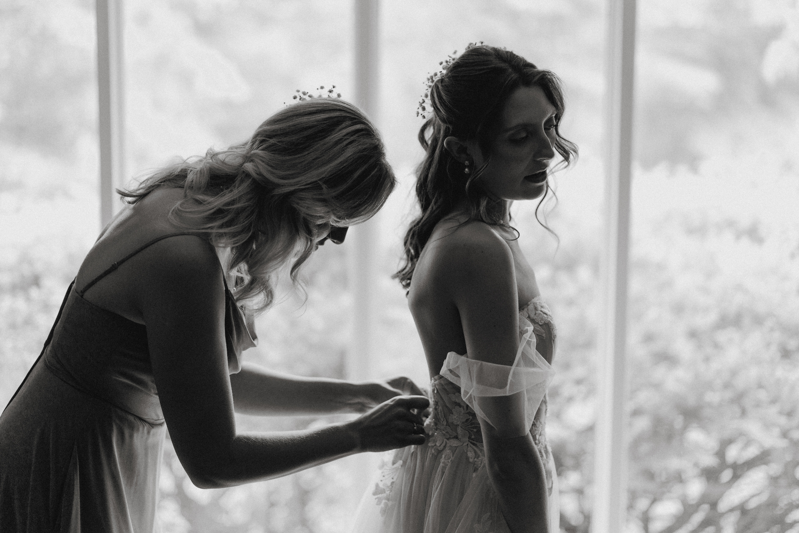 black white film bride getting ready dress