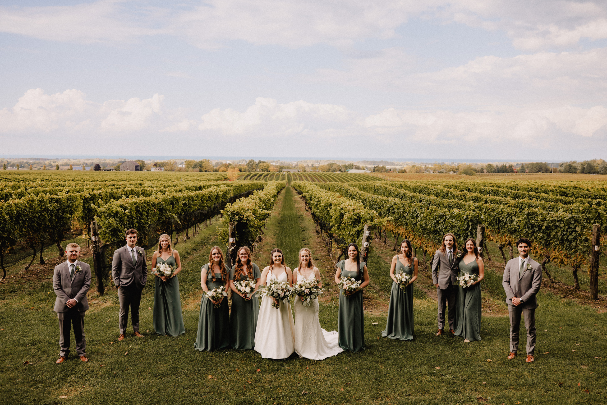 wedding party group photo cave spring vineyard fall autumn