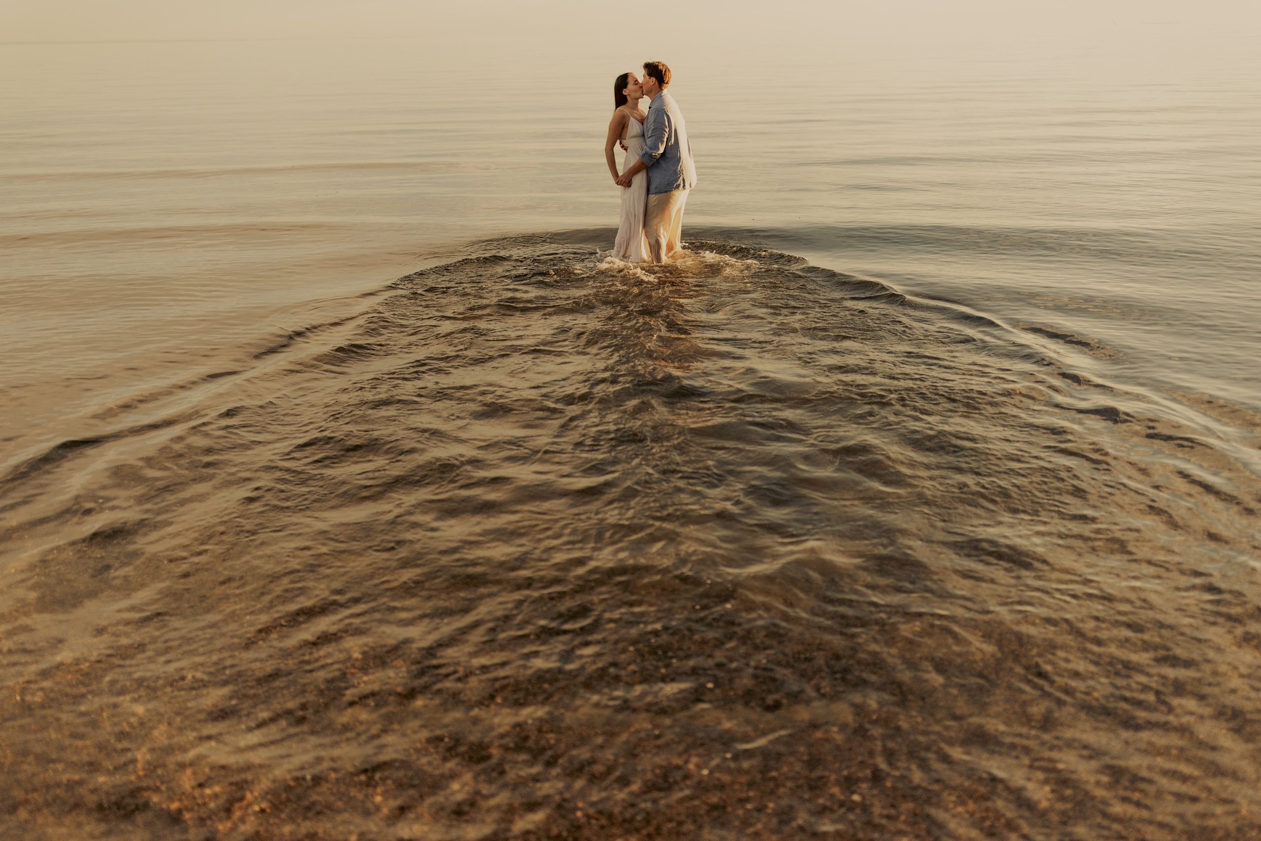 cute couple in water engagement photos kiss niagara afterglow